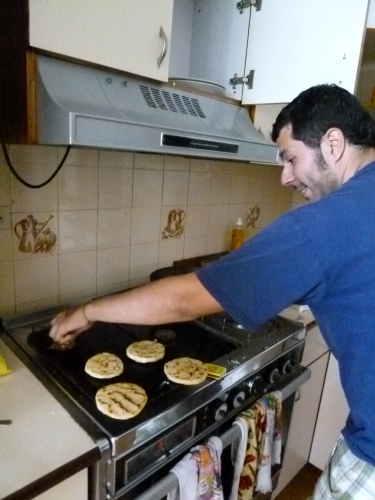 Gabriel is making some arepas for us